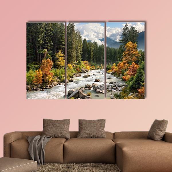 Mountain Stream in Autumn Forest Canvas Wall Art in brown, orange and green, 3 panel horizontal set hung on a wall
