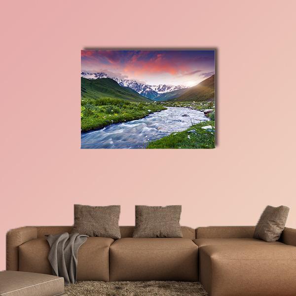 Sunset Mountain Stream in Grassy Valley Canvas Wall Art in orange, green and blue, single panel hung on a wall