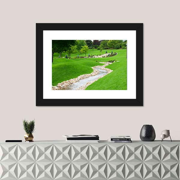 Stream Of Water Flowing Through Grassy Hills With Trees Canvas Wall Art-1 Piece-Framed Print-20" x 16"-Tiaracle