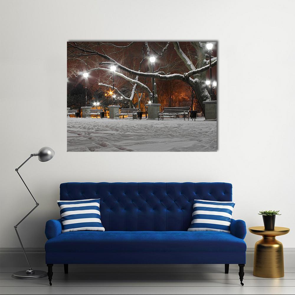 Snowy Park with Glowing Lanterns at Night Canvas Wall Art in black, white and orange, single panel hung on a wall