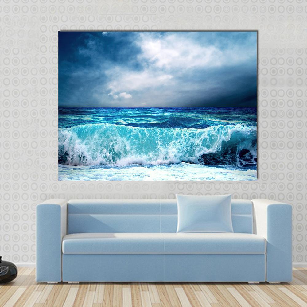 Crashing Storm Wave Seascape Canvas Wall Art in white, blue and navy, single panel hung on a wall