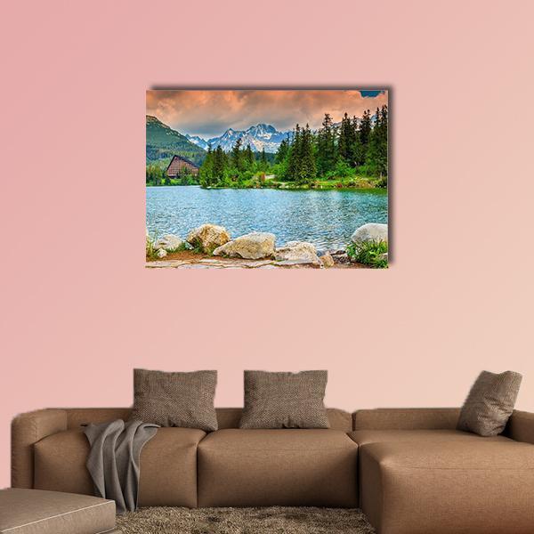 Slovakia Mountain Lake with Cabin Canvas Wall Art in orange, green and blue, single panel hung on a wall