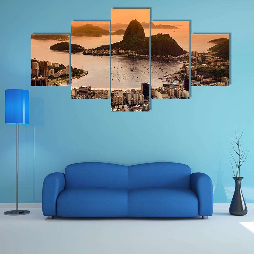 Sugarloaf and Botafogo Beach at Sunset Canvas Wall Art in brown, orange and yellow, 5 panel Star layout hung on a wall