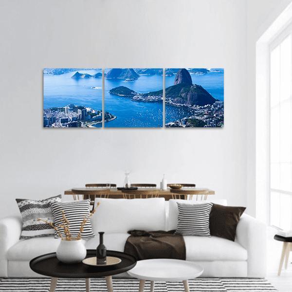 Sugarloaf Mountain Over Botafogo Beach Panoramic Canvas Wall Art in white and blue, hung on a wall