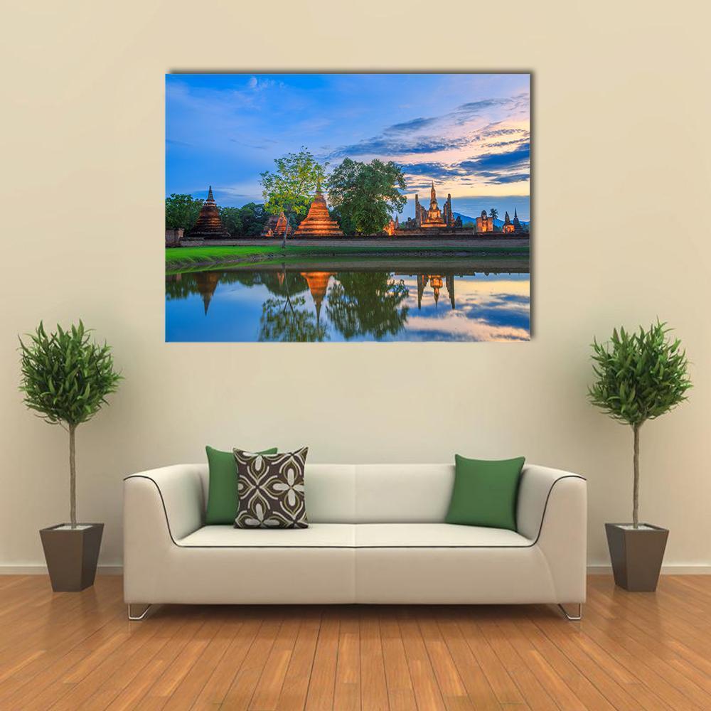 Sukhothai Historical Park Sunset Reflection Canvas Wall Art in orange, green and blue, single panel hung on a wall