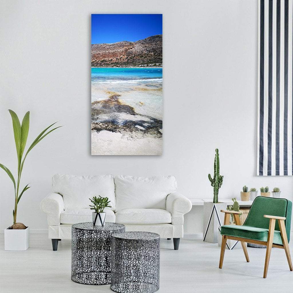 Turquoise Lagoon Beach Landscape Vertical Canvas Wall Art in beige, brown and blue, single vertical panel hung on a wall