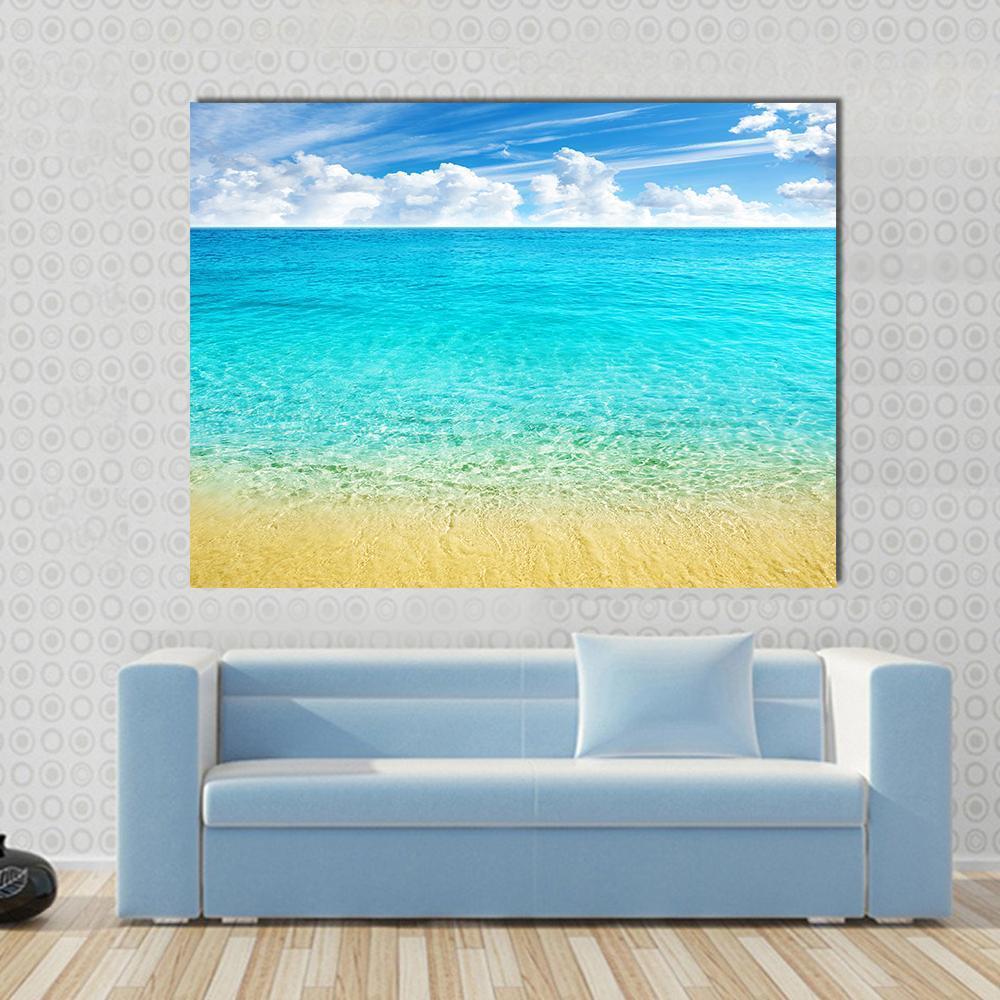 Summer Beach with Turquoise Water and Blue Sky Canvas Wall Art in white, beige and blue, single panel hung on a wall