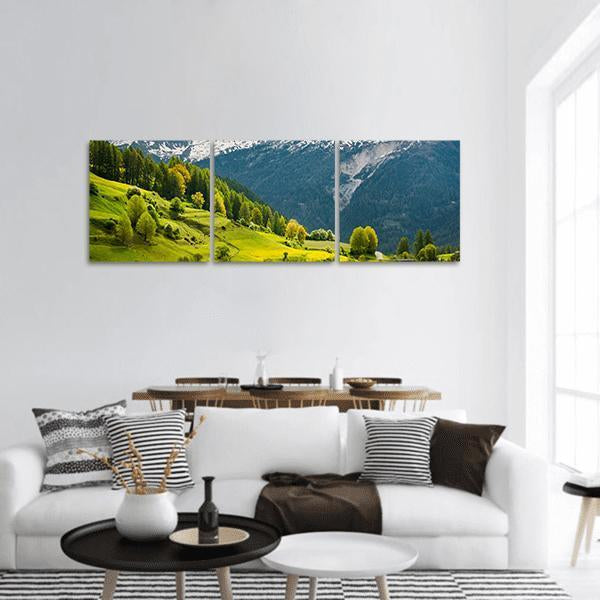 Alpine Summer in Switzerland Panoramic Canvas Wall Art in white, green and blue, hung on a wall