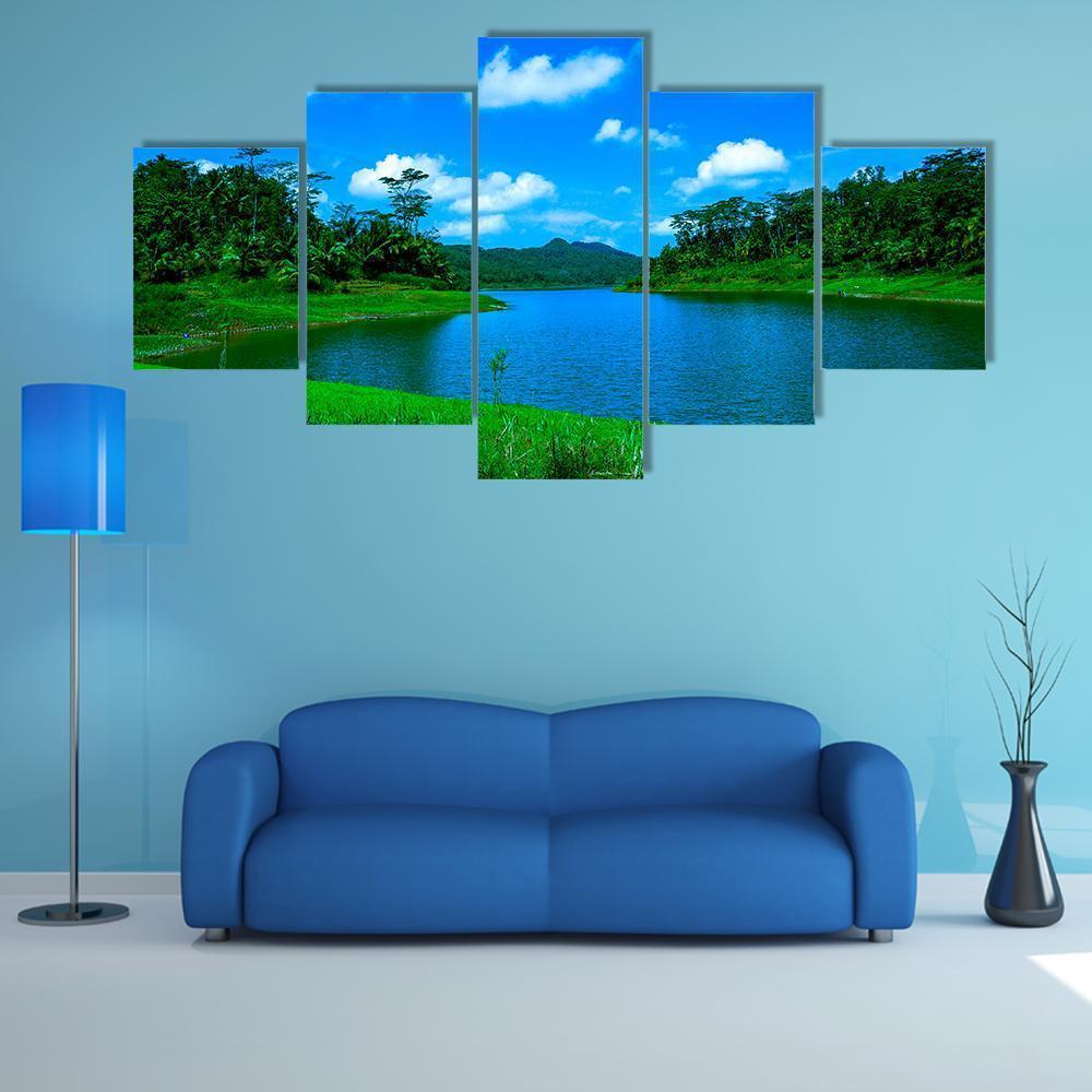Summer Lake in Indonesia Canvas Wall Art in green and blue, 5 panel Star layout hung on a wall