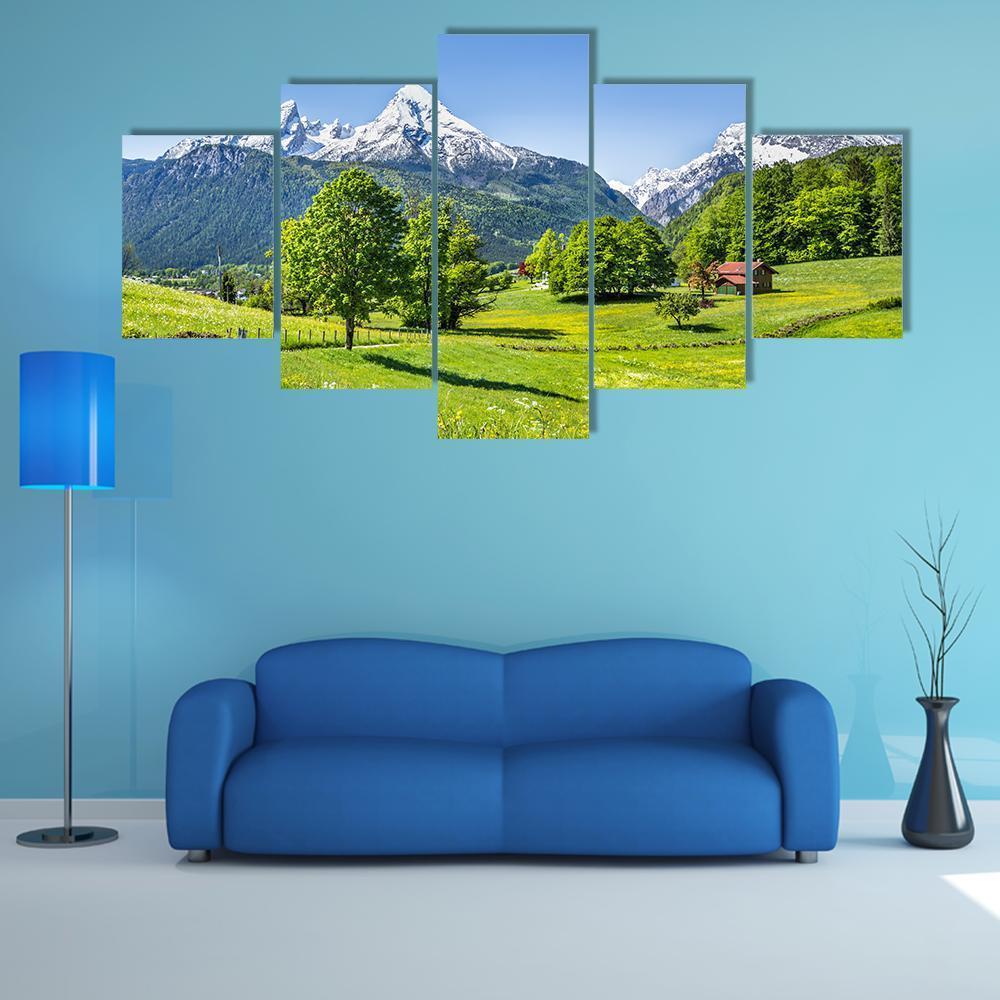 Summer Mountain Meadow with Red Roof Canvas Wall Art in white, green and blue, 5 panel Star layout hung on a wall