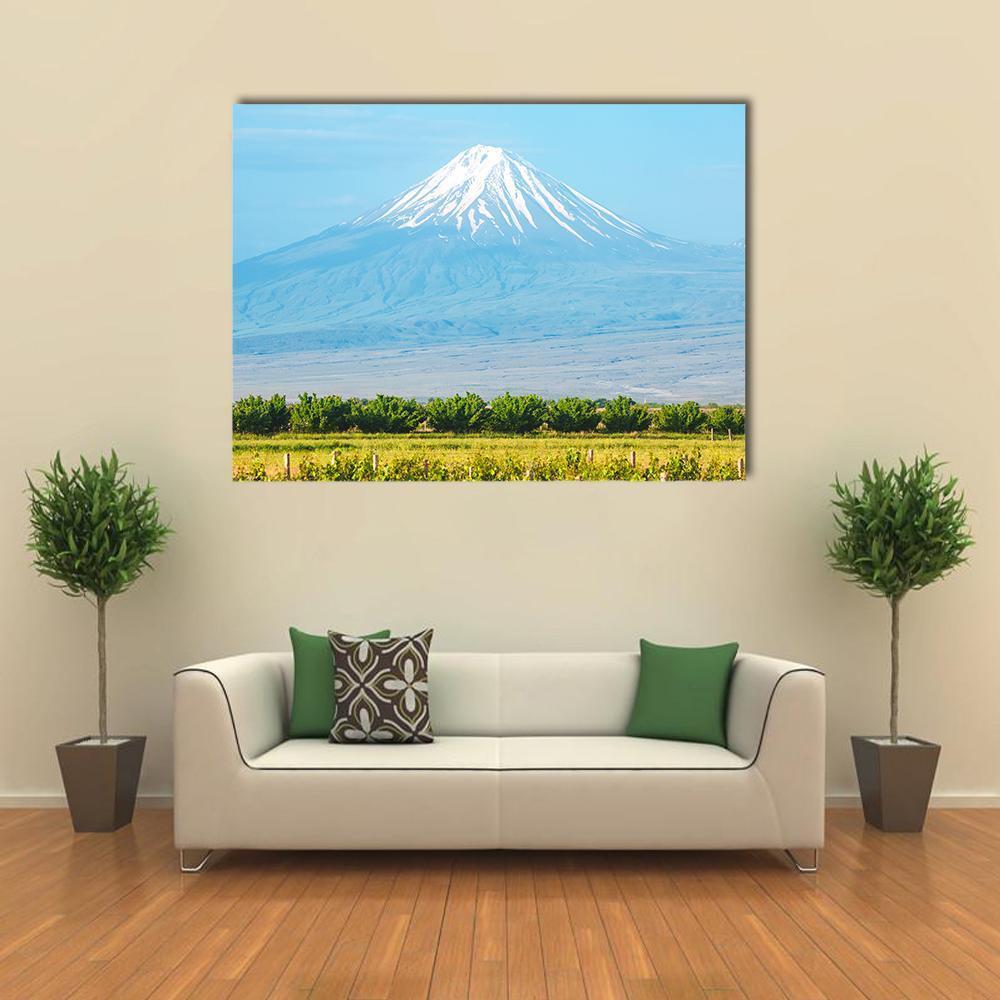 Summer Mountain Landscape with Snow-capped Peak Canvas Wall Art in white, green and blue, single panel hung on a wall