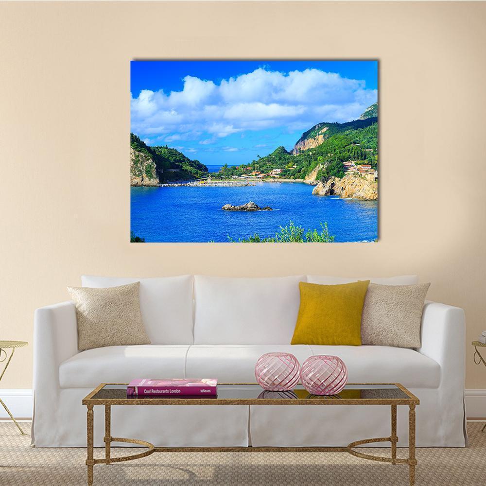 Summer Cove with Terracotta Village Canvas Wall Art in green and blue, single panel hung on a wall