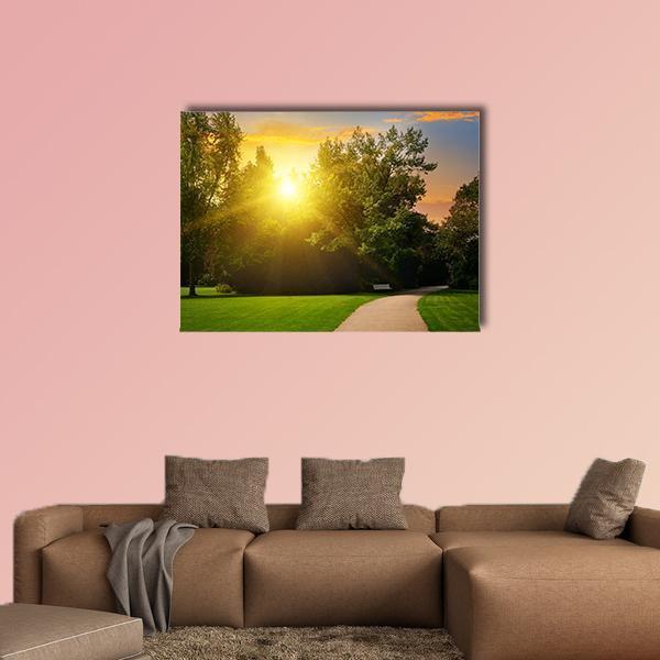 Summer Park at Sunset Canvas Wall Art in orange, yellow and green, single panel hung on a wall