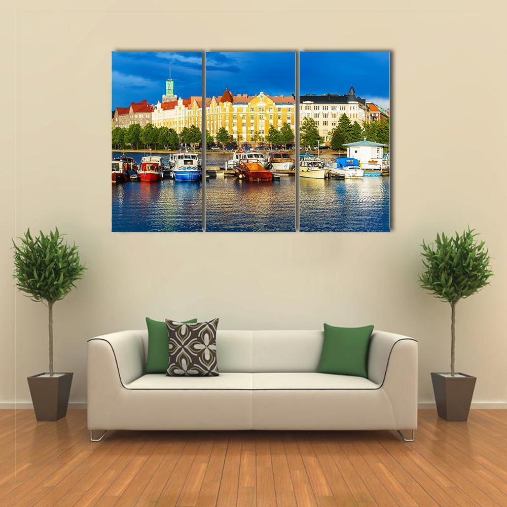 Summer Scenery of the Old Town in Helsinki Canvas Wall Art in orange, yellow and blue, 3 panel horizontal set hung on a wall