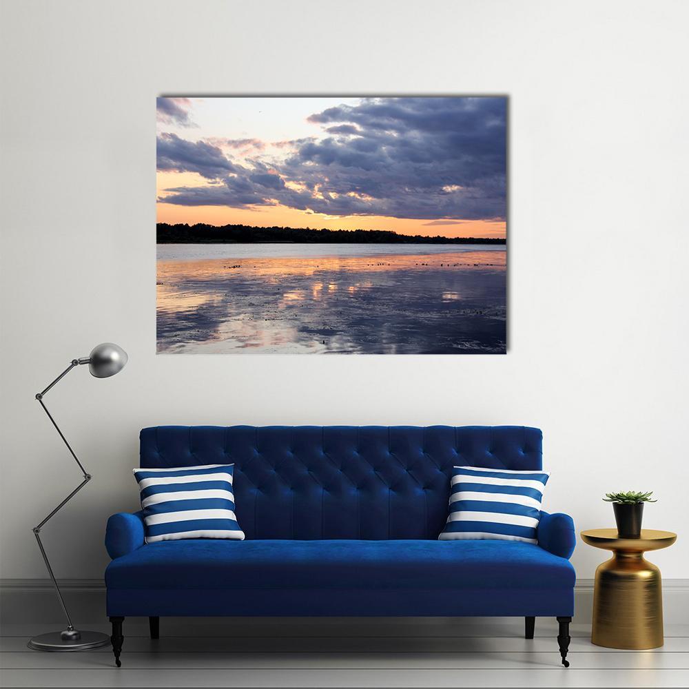 Summer Sunset on River Daugava, Latvia Canvas Wall Art in orange, blue and purple, single panel hung on a wall