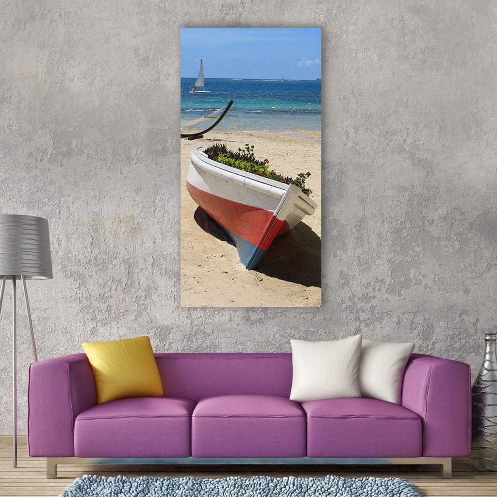 Boat Planter on Tropical Beach with Flowers Vertical Canvas Wall Art in white, beige and blue, single vertical panel hung on a wall