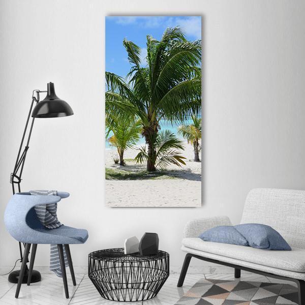 Palm Trees on White Sand Beach Vertical Canvas Wall Art in white, green and blue, single vertical panel hung on a wall
