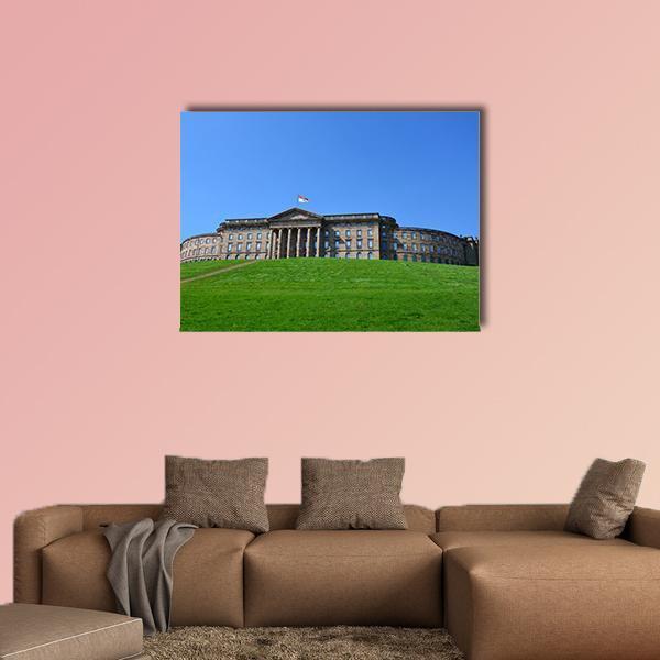 Summer View of Neoclassical Palace Canvas Wall Art in brown, green and blue, single panel hung on a wall