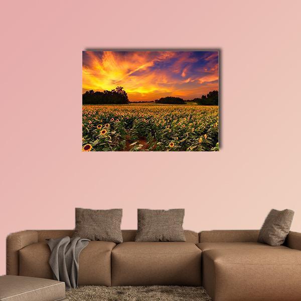Sunflower Field at Sunset Canvas Wall Art in orange, yellow and green, single panel hung on a wall