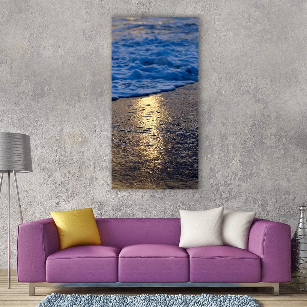 Sunlit Beach Wave with Golden Reflection Vertical Canvas Wall Art in brown, gold and blue, single vertical panel hung on a wall