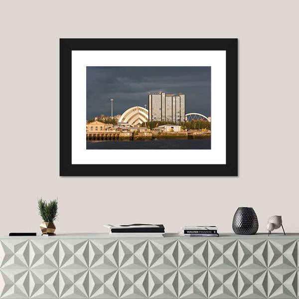 Sunlight On Buildings As Storm Clouds Canvas Wall Art-1 Piece-Framed Print-20" x 16"-Tiaracle