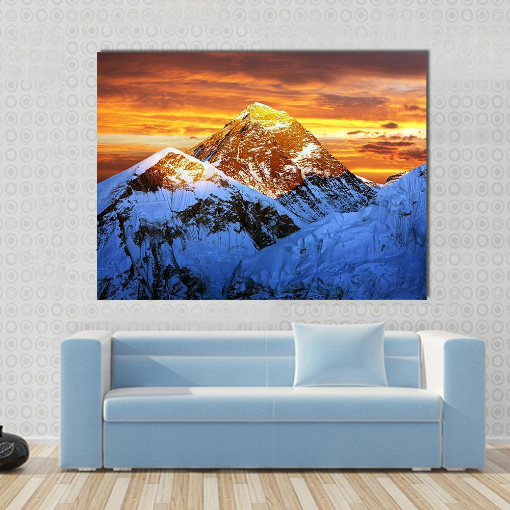 Sunlight on Everest Canvas Wall Art in white, orange and blue, single panel hung on a wall