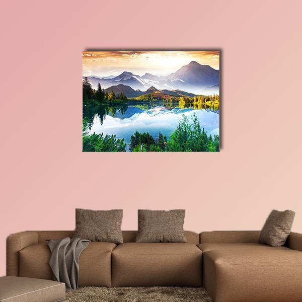 Snow-capped Mountains Over Reflective Lake Canvas Wall Art in white, green and blue, single panel hung on a wall