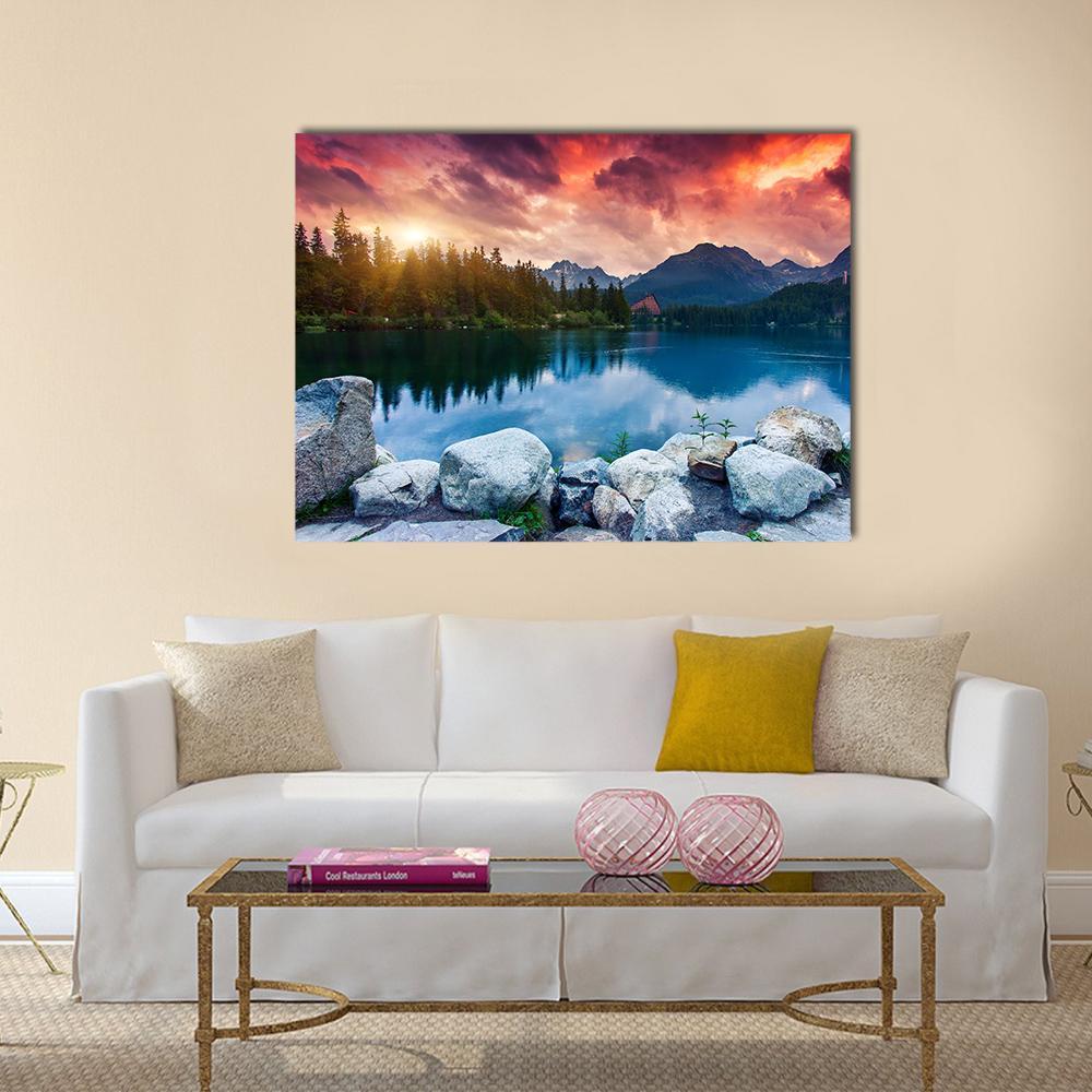 Sunset Reflection on Mountain Lake Canvas Wall Art in orange, blue and pink, single panel hung on a wall