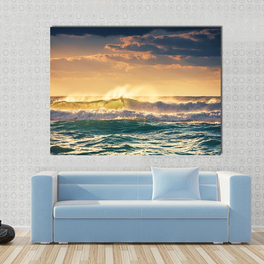Sunrise and Shining Waves in Ocean Canvas Wall Art in orange, yellow and blue, single panel hung on a wall