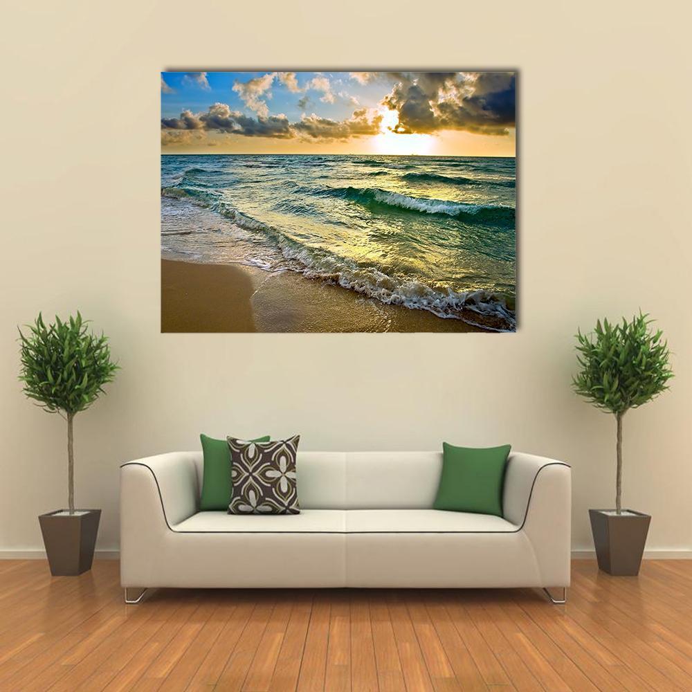 Sunset on Atlantic Ocean Coast Near Florida Usa Canvas Wall Art in orange, yellow and blue, single panel hung on a wall