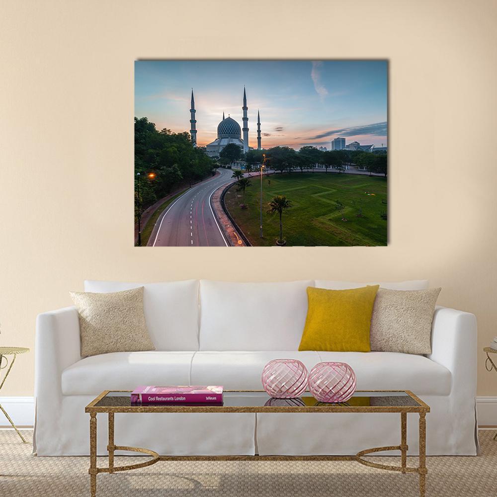 Sunrise Over Blue Mosque in Malaysia Canvas Wall Art in orange, green and blue, single panel hung on a wall