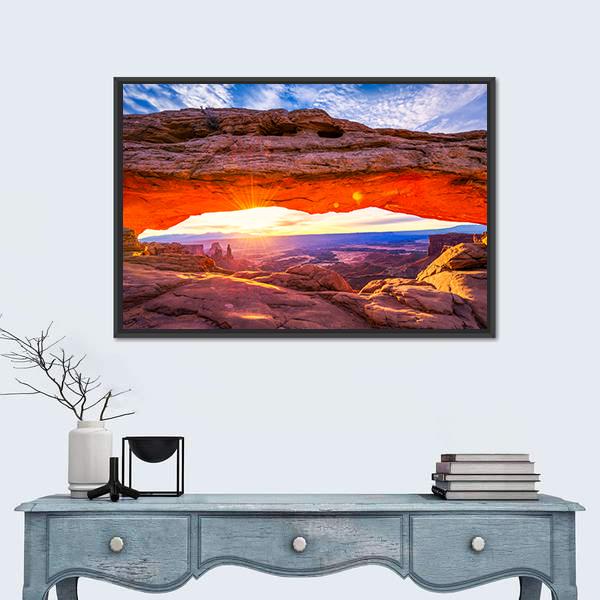 Sunrise at Mesa Arch Canvas Wall Art in brown, orange and blue, framed canvas, product view on a white background