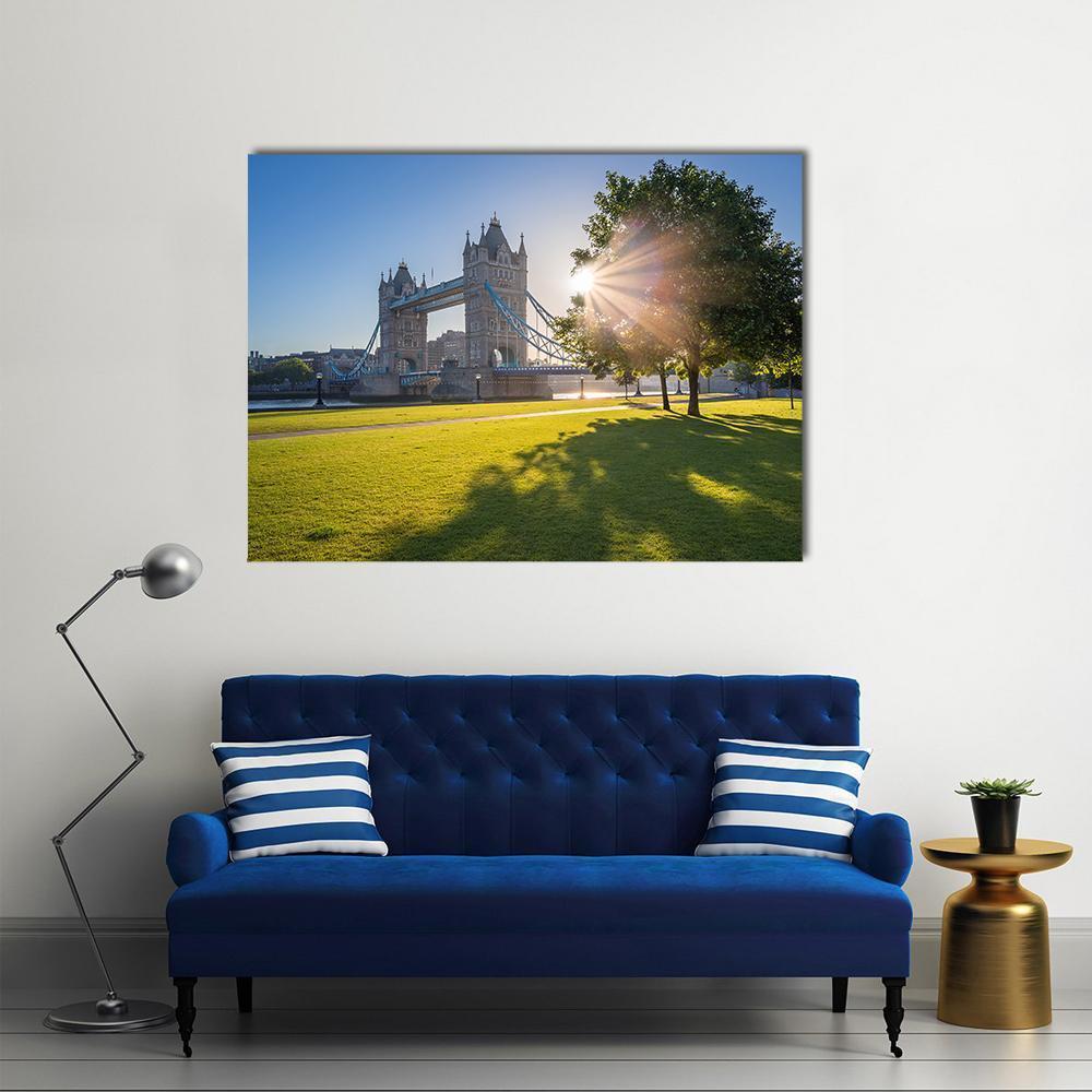 Sunrise Over Tower Bridge Canvas Wall Art in yellow, green and blue, single panel hung on a wall