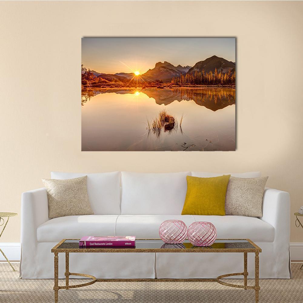Sunrise Over Snow-dusted Mountain Lake Canvas Wall Art in brown, orange and yellow, single panel hung on a wall