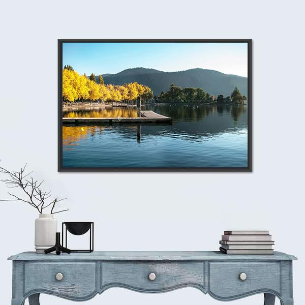 Fall Sunrise Over Lake with Wooden Dock Canvas Wall Art in orange, yellow and blue, framed canvas, product view on a white background