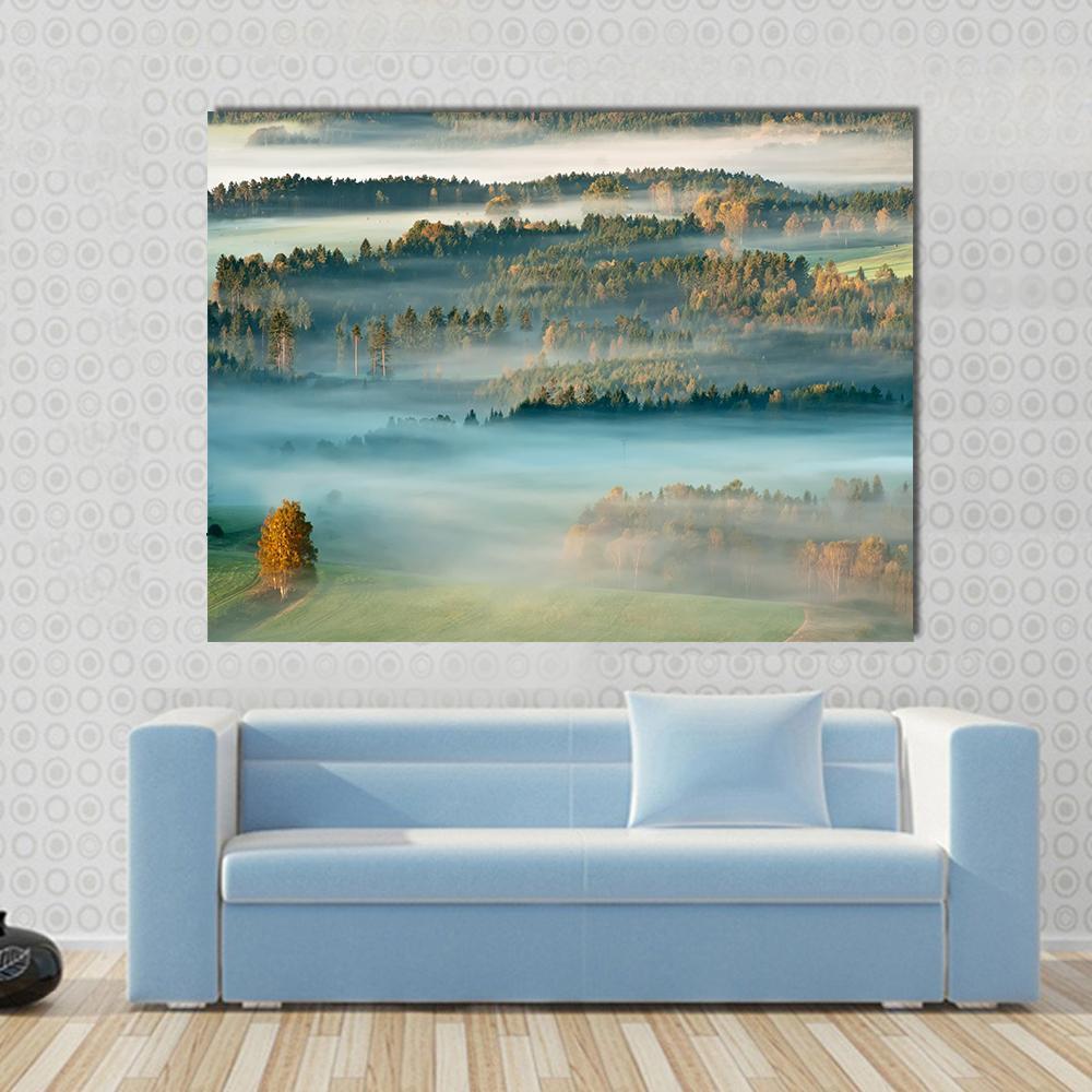 Sunrise Over the Mountains of Czech-saxony Canvas Wall Art in yellow, green and blue, single panel hung on a wall