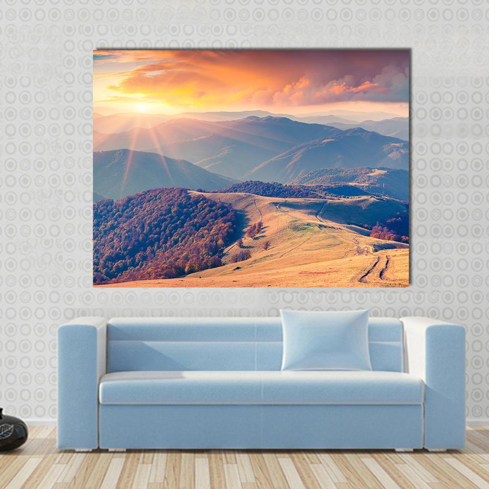 Sunrise in the Carpathian Mountains Canvas Wall Art in orange, yellow and blue, single panel hung on a wall