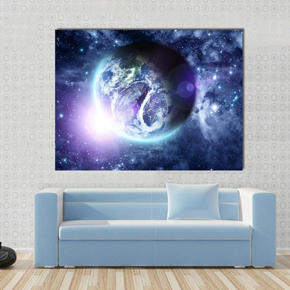 Sunrise on Blue Planet Earth in Deep Space Canvas Wall Art in black, blue and purple, single panel hung on a wall
