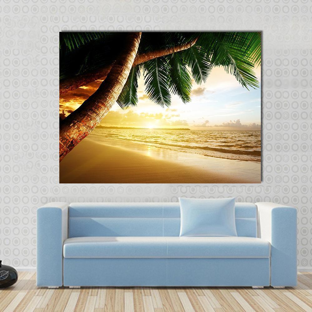 Sunrise on Caribbean Beach Canvas Wall Art in brown, yellow and green, single panel hung on a wall