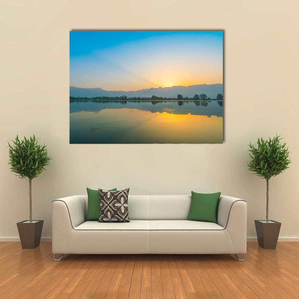Sunrise Over Dal Lake Canvas Wall Art in orange, yellow and blue, single panel hung on a wall