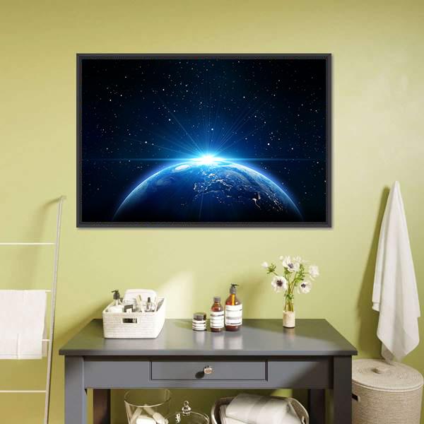 Sunrise Over Earth from Space Canvas Wall Art in black and blue, framed canvas, product view on a white background