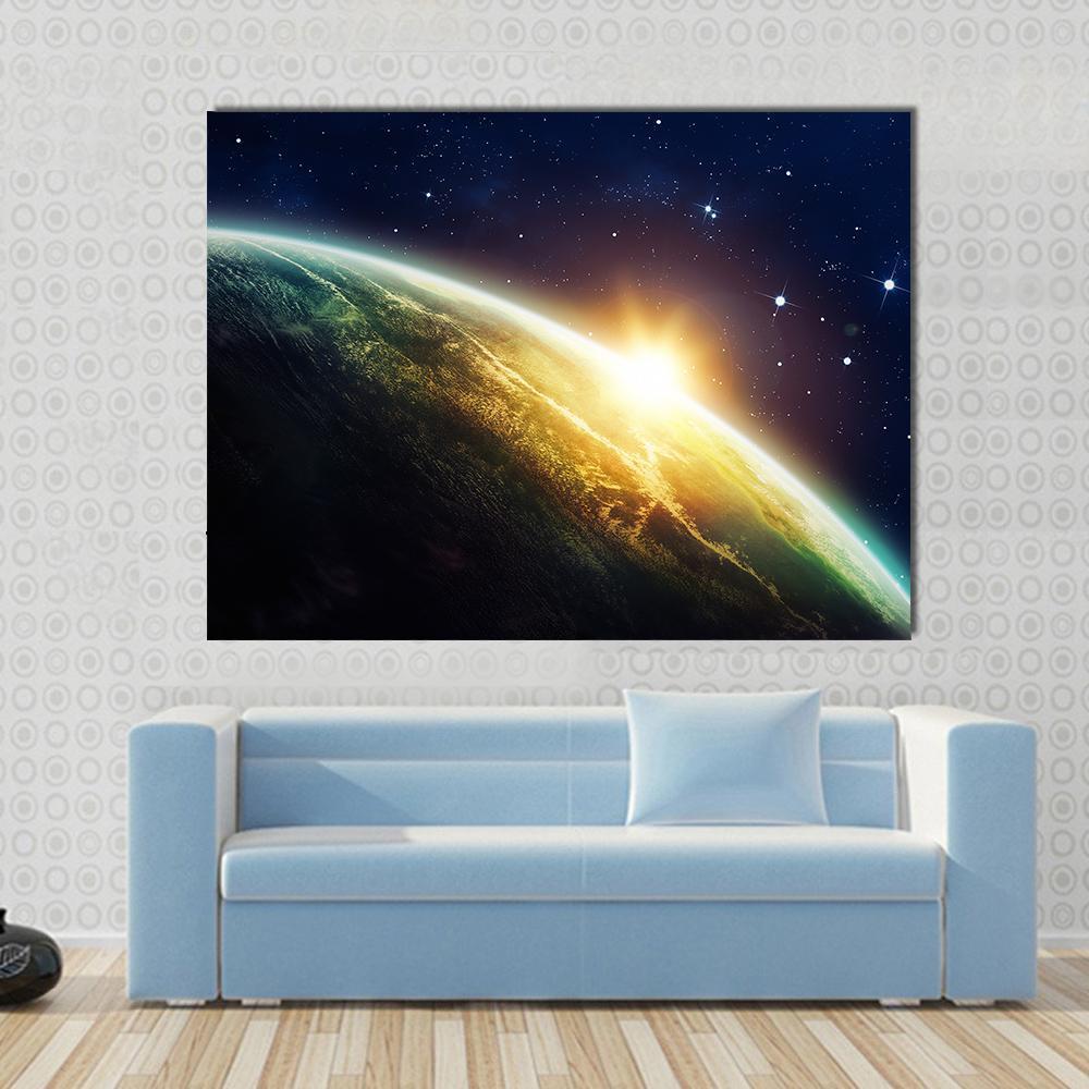 Sunrise on the Planet from Space Canvas Wall Art in black, yellow and blue, single panel hung on a wall