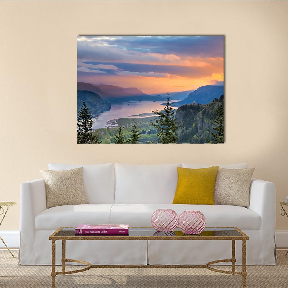 Sunrise Over Columbia River Canvas Wall Art in orange, yellow and blue, single panel hung on a wall