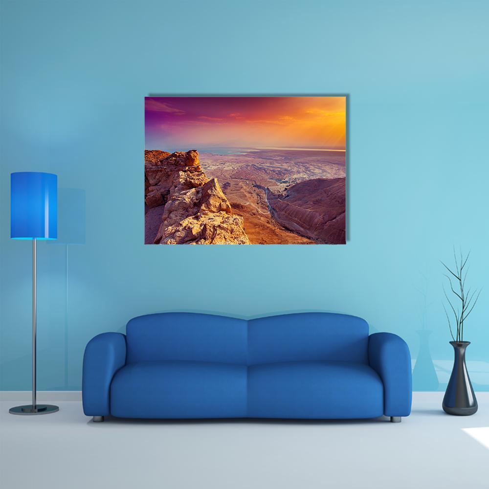 Sunset Over Desert Canyon Canvas Wall Art in brown, orange and purple, single panel hung on a wall