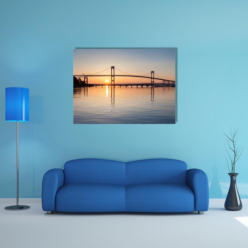 Sunrise Over Newport Bridge Canvas Wall Art in orange, yellow and blue, single panel hung on a wall