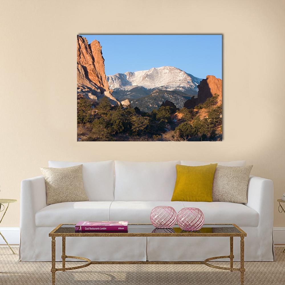 Sunrise Over Pikes Peak Canvas Wall Art in brown, orange and blue, single panel hung on a wall