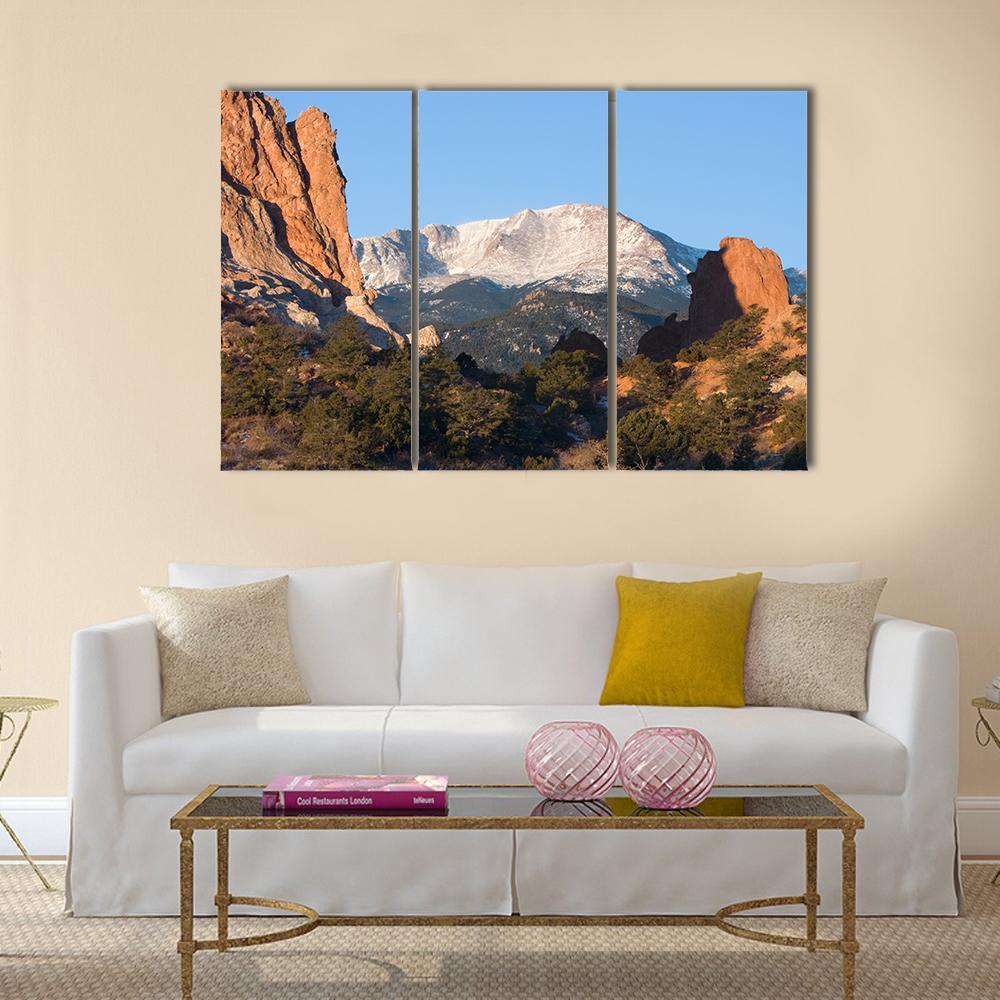 Sunrise Over Pikes Peak Canvas Wall Art in brown, orange and blue, 3 panel horizontal set hung on a wall