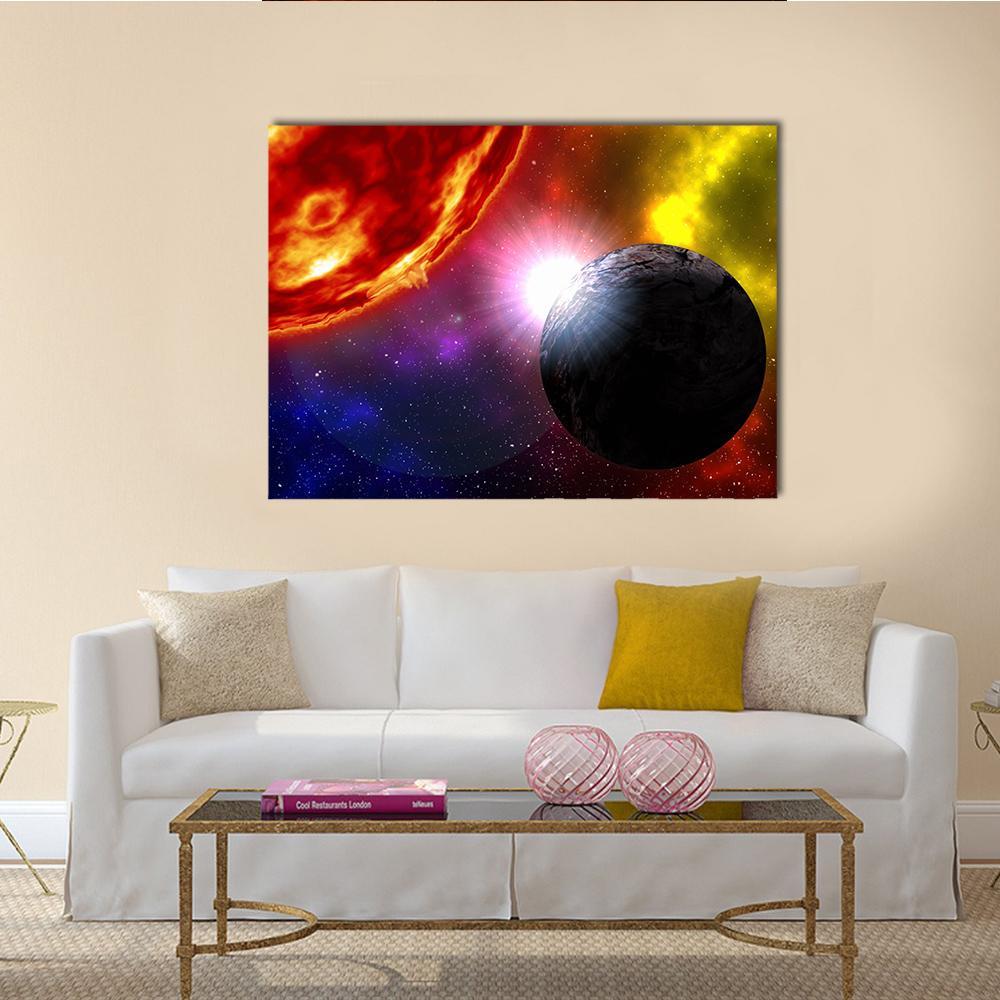 Sunrise Over Dark Rocky Planet Canvas Wall Art in black, red and yellow, single panel hung on a wall