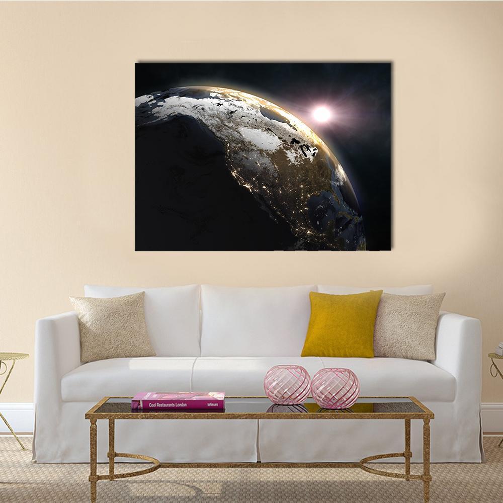 Sunrise Over Earth Canvas Wall Art in black, white and gold, single panel hung on a wall