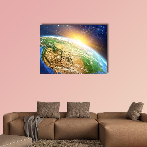 Sunrise Over the Earth Canvas Wall Art in yellow, green and blue, single panel hung on a wall